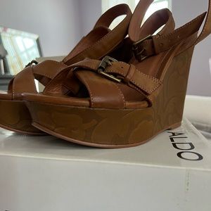Aldo Brown Summer Wedge with Flower detailing on the Wedge.
